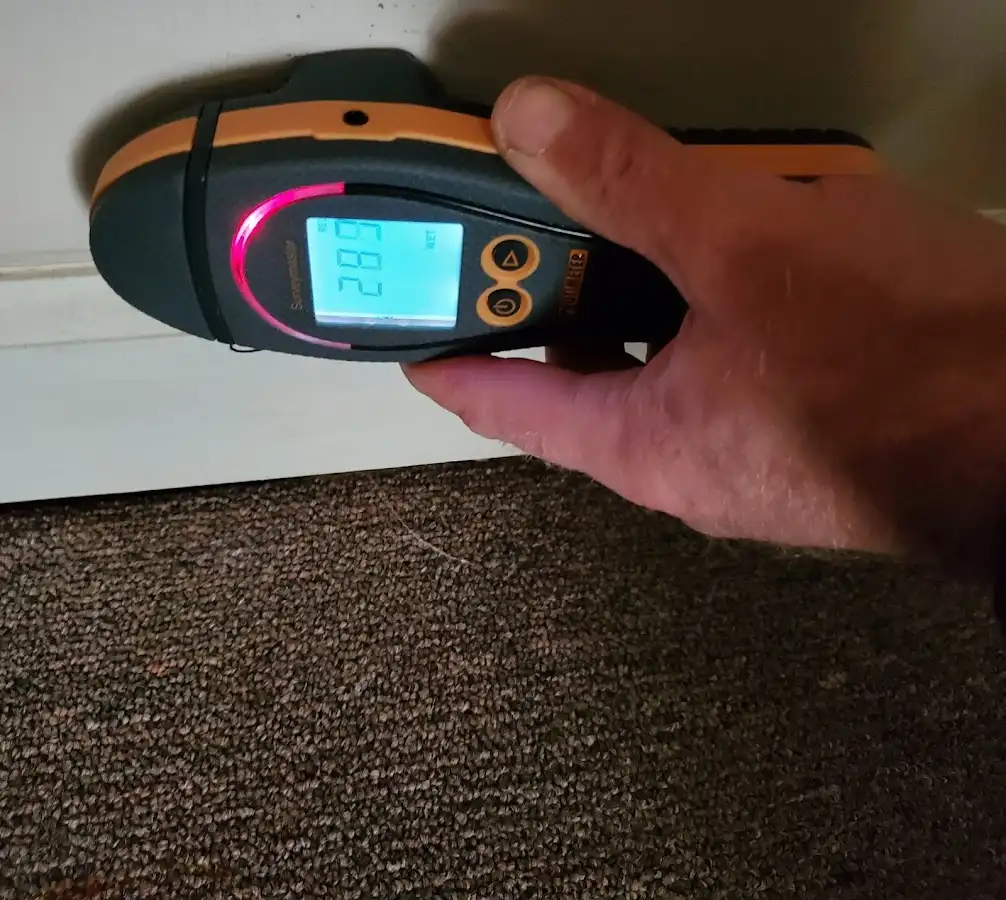 Moisture detection at baseboard during Storm Damage Restoration in La Marque